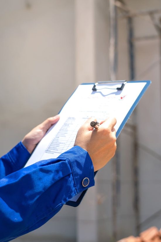 An,Architect,Is,Checking,On,House,Building,Quality,Checklist,Form